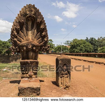 Naga sculpture on the Spean 'Preah Toeus' laterite bridge, dating to the Angkor period, Bayon Style (1181-1220), crossing the Chikreng River; Kampong Thom, Cambodia View Large Photo Image Stock Photograph - Naga sculpture on the Spean 'Preah Toeus' laterite bridge, dating to the Angkor period, Bayon Style (1181-1220), crossing the Chikreng River; Kampong Thom, Cambodia. Fotosearch