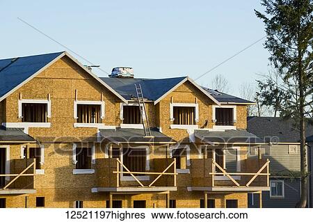 Stock Photograph - New home construction in a neighbourhood; Langley, British Columbia, Canada. Fotosearch