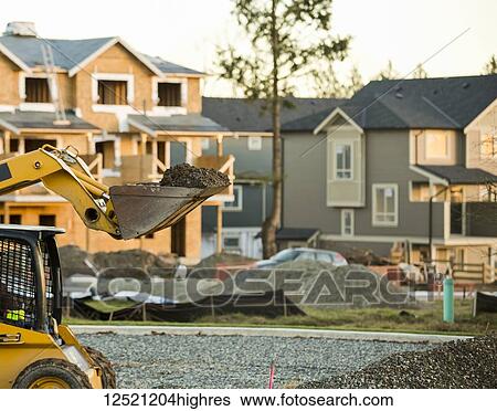 Stock Photograph - New home construction in a neighbourhood; Langley, British Columbia, Canada. Fotosearch
