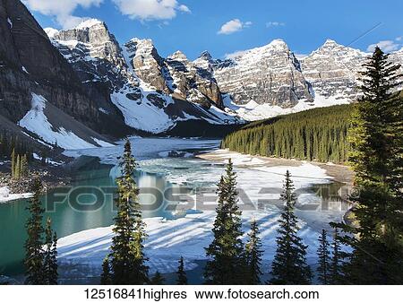 NoneSnow and ice on Moraine Lake with snow on the Rocky Mountains near Lake Louise, Banff National Park; Alberta, Canada View Large Photo Image Stock Photograph - NoneSnow and ice on Moraine Lake with snow on the Rocky Mountains near Lake Louise, Banff National Park; Alberta, Canada. Fotosearch