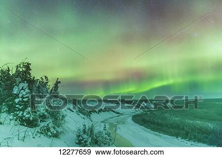 Stock Photo - Northern lights over the Copper River near Glennallen, Southcentral Alaska, USA, Winter. Fotosearch