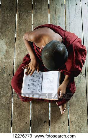 Novice buddhist monk reading a book; Bagan, Myanmar View Large Photo Image Stock Photo - Novice buddhist monk reading a book; Bagan, Myanmar. Fotosearch