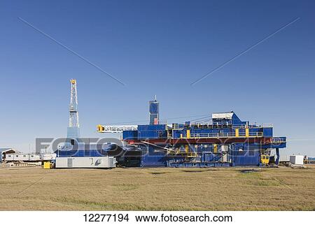 Oil and gas drill rig with surrounding infrastructure, Prudhoe Bay, Arctic Alaska, USA, Summer View Large Photo Image Picture - Oil and gas drill rig with surrounding infrastructure, Prudhoe Bay, Arctic Alaska, USA, Summer . Fotosearch