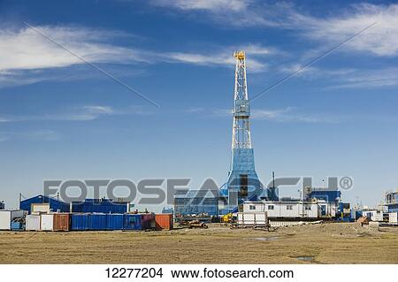 Oil and gas drill rig with surrounding infrastructure, Prudhoe Bay, Arctic Alaska, USA, Summer View Large Photo Image Picture - Oil and gas drill rig with surrounding infrastructure, Prudhoe Bay, Arctic Alaska, USA, Summer . Fotosearch