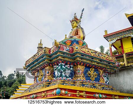 Ornate and colourful facade of a religious structure and statue; Bara Adalpur Dwitiya Khanda, West Bengal, IndiaWest Bengal, India View Large Photo Image Stock Photograph - Ornate and colourful facade of a religious structure and statue; Bara Adalpur Dwitiya Khanda, West Bengal, IndiaWest Bengal, India. Fotosearch