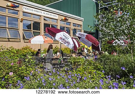 Outdoor patio of Twisted Fish Co. Alaskan Grill located in Miners Cove building next to Juneau Seawalk; Southeast Alaska View Large Photo Image Stock Image - Outdoor patio of Twisted Fish Co. Alaskan Grill located in Miners Cove building next to Juneau Seawalk; Southeast Alaska. Fotosearch