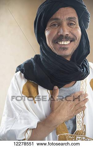 Stock Image - Portrait of a desert guide; Merzouga, Morocco. Fotosearch