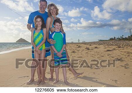Portrait of a family on the beach on a hawaiian island; Kailua, Island of Hawaii, Hawaii, United States of America View Large Photo Image Stock Photography - Portrait of a family on the beach on a hawaiian island; Kailua, Island of Hawaii, Hawaii, United States of America. Fotosearch