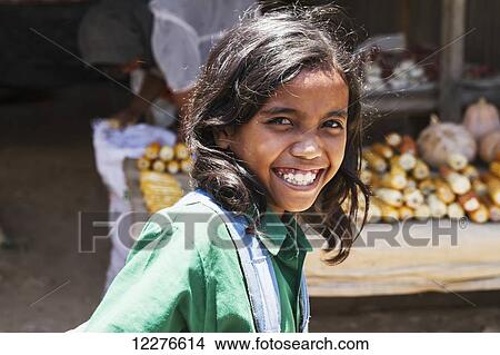 Portrait of a girl at the market; Baucau, East Timor View Large Photo Image Picture - Portrait of a girl at the market; Baucau, East Timor. Fotosearch