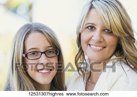 Portrait of a mother and daughter in a park in autumn; Edmonton, Alberta, Canada View Large Photo Image Stock Photograph - Portrait of a mother and daughter in a park in autumn; Edmonton, Alberta, Canada. Fotosearch