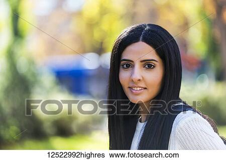 Portrait of a young female university student of Lebanese ethnicity on campus; Edmonton, Alberta, Canada View Large Photo Image Stock Photograph - Portrait of a young female university student of Lebanese ethnicity on campus; Edmonton, Alberta, Canada. Fotosearch