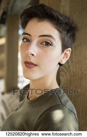 Portrait of a young woman with short brunette hair View Large Photo Image Stock Photograph - Portrait of a young woman with short brunette hair. Fotosearch