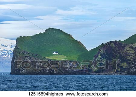 Stock Photograph - Puffin hunters house on Ellirey Island; Westman Islands, Iceland. Fotosearch