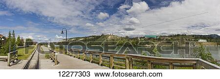 Railroad tracks run parallel to the Yukon River, Whitehorse, Yukon, Canada, Summer, Panorama View Large Photo Image Stock Image - Railroad tracks run parallel to the Yukon River, Whitehorse, Yukon, Canada, Summer, Panorama. Fotosearch
