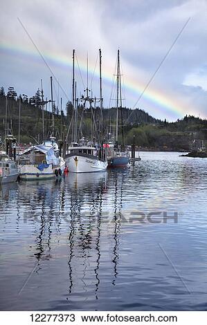 Stock Image - Rainbow over Port Hardy, Canada, British Columbia, Vancouver Island. Fotosearch
