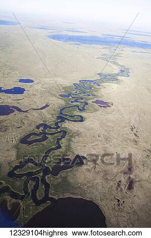 Stock Photograph - River running through the coastal plains, North Slope Borough; Alaska, United States of America. Fotosearch