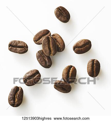 Roasted coffee beans on a white background View Large Photo Image Stock Photograph - Roasted coffee beans on a white background. Fotosearch