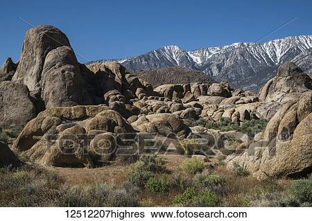 Stock Photograph - Rock formations in the Alabama Hills with blue sky; California, United States of America. Fotosearch