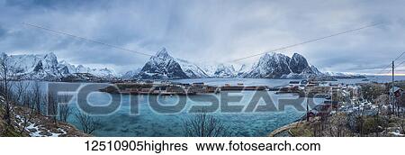 Stock Photograph - Rugged mountains along the coastline of the Lofoten Islands with turquoise ocean water; Svolvar, Lofoten Islands, Nordland, Norway. Fotosearch