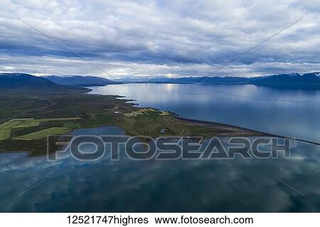 Scenic landscape of Northern Iceland along the coast under cloudy skies; Hofsos, Iceland View Large Photo Image Stock Photograph - Scenic landscape of Northern Iceland along the coast under cloudy skies; Hofsos, Iceland. Fotosearch