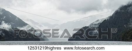 Stock Photograph - Scenic views of the Great Bear Rainforest with mist and low cloud; Hartley Bay, British Columbia, Canada. Fotosearch