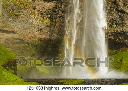 Seljalandsfoss waterfall and a rainbow in the mist; Iceland View Large Photo Image Stock Photograph - Seljalandsfoss waterfall and a rainbow in the mist; Iceland. Fotosearch