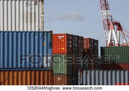 Stock Photograph - Shipping containers and crane in Halifax harbour; Halifax, Nova Scotia, Canada. Fotosearch