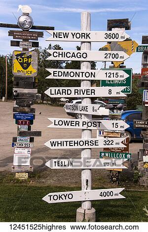 Signpost forest displaying numerous destination and distance signs; Watson Lake, Yukon, Canada View Large Photo Image Stock Photograph - Signpost forest displaying numerous destination and distance signs; Watson Lake, Yukon, Canada. Fotosearch