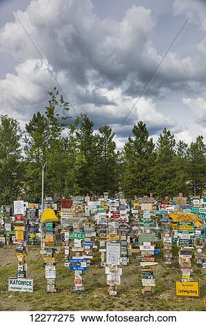 Stock Photography - Signpost forest, Watson Lake, Yukon Territory, Canada, Summer. Fotosearch