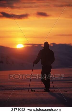 Silhouette Of Cross-Country Skier On Mount Douglas Watching Sunset In Katmai National Park Alaska View Large Photo Image Stock Image - Silhouette Of Cross-Country Skier On Mount Douglas Watching Sunset In Katmai National Park Alaska. Fotosearch