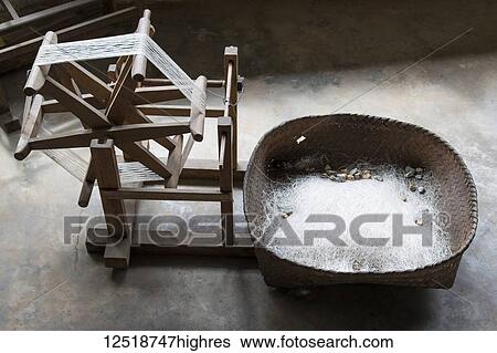 Stock Photograph - Silk reel at the Mulberry Silk Farm, Ban Li; Xiangkhouang, Laos. Fotosearch