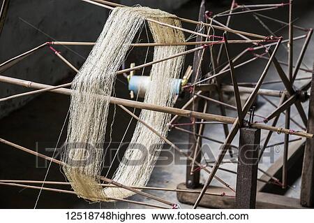 Stock Photograph - Silk reel at the Mulberry Silk Farm, Ban Li; Xiangkhouang, Laos. Fotosearch
