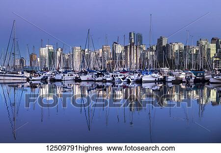 Skyline and harbour of Vancouver at twilight with reflections in the water; Vancouver, British Columbia, Canada View Large Photo Image Stock Photograph - Skyline and harbour of Vancouver at twilight with reflections in the water; Vancouver, British Columbia, Canada. Fotosearch