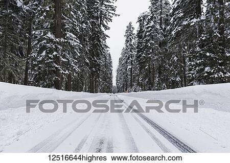 Stock Photograph - Snowy road with icy conditions in the mountains; Keno, Oregon, United States of America. Fotosearch