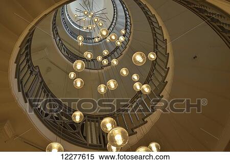 Spiral staircase with lights at Heal's department store, Tottenham Court Road; London, England View Large Photo Image Stock Photography - Spiral staircase with lights at Heal's department store, Tottenham Court Road; London, England. Fotosearch