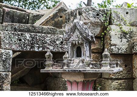 Spirit house by the ancient Angkorian temple at Wat Ek Phnom; Battambang, Cambodia View Large Photo Image Stock Photograph - Spirit house by the ancient Angkorian temple at Wat Ek Phnom; Battambang, Cambodia. Fotosearch