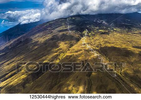 Stock Photograph - Springtime aerial view showing the Kahea Wind Power wind farm on West Maui, Hawaii, USA that is positioned to capture power from the trade winds that funnel through Maui's central valley; Maui, Hawaii, United States of America. Fotosearch