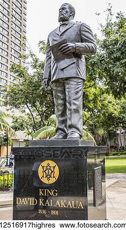 Stock Photograph - Statue of Hawaiin King David Kalakua located in Waikiki Gateway Parkbetween Kuhio and Kalakua avenues, Waikiki; Honolulu, Oahu, Hawaii, United States of America. Fotosearch