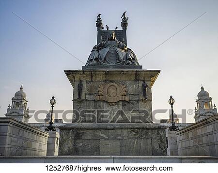 Stock Photograph - Statue of Queen Victoria at the Victoria Memorial, dedicated to the memory of Queen Victoria; Kolkata, West Bengal, India. Fotosearch