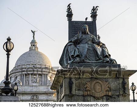 Stock Photograph - Statue of Queen Victoria at the Victoria Memorial, dedicated to the memory of Queen Victoria; Kolkata, West Bengal, India. Fotosearch