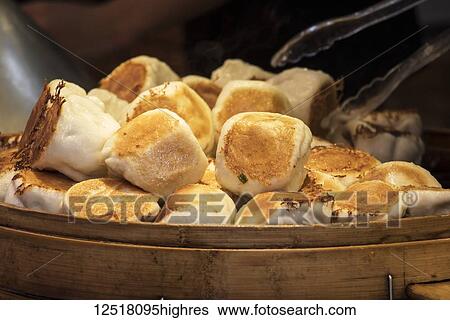 Stock Photograph - Steamed dumplings for sale on Kulangsu Island; Xiamen, Fujian, China. Fotosearch