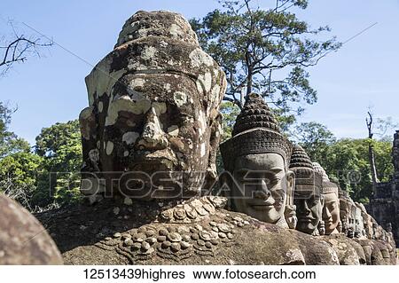 Stone figures on the causeway to the South Gate tower (Gopuram); Angkor Thom, Siem Reap, Cambodia View Large Photo Image Stock Photograph - Stone figures on the causeway to the South Gate tower (Gopuram); Angkor Thom, Siem Reap, Cambodia. Fotosearch