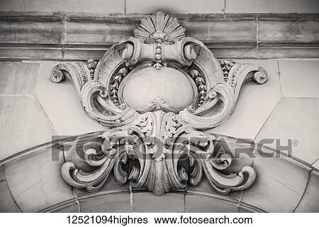 Stock Photograph - Stone ornamentation on the exterior of a structure; Winnipeg, Manitoba, Canada. Fotosearch
