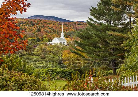 Stowe Church surrounded by lush and autumn coloured foliage with forest on the hillside; Stowe, Vermont, United States of America View Large Photo Image Stock Photograph - Stowe Church surrounded by lush and autumn coloured foliage with forest on the hillside; Stowe, Vermont, United States of America. Fotosearch