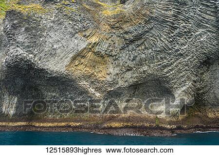 Stock Photograph - Strange basalt rock formations on Heimaey, the largest of the Westman Islands; Iceland. Fotosearch