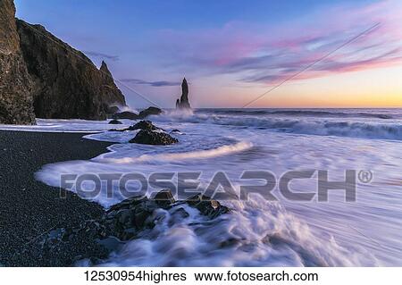 Stunning sunset over the sea stacks near Vik; Iceland View Large Photo Image Stock Photograph - Stunning sunset over the sea stacks near Vik; Iceland. Fotosearch