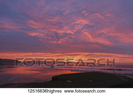 Stock Photograph - Sunrise at the beach with waves, Point Reyes National Seashore; Inverness, California, United States of America. Fotosearch