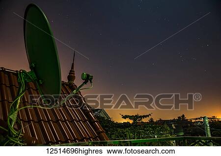 Sunrise over North Vietnam with a satellite dish on a roof in the foreground; Fangchenggang Shi, Guangxi Zhuangzuzizhiqu, China View Large Photo Image Stock Photograph - Sunrise over North Vietnam with a satellite dish on a roof in the foreground; Fangchenggang Shi, Guangxi Zhuangzuzizhiqu, China. Fotosearch