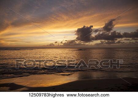 Stock Photograph - Sunset at Ke'e beach, Ha'ena State Park; Hanalei, Kauai, Hawaii, United States of America. Fotosearch