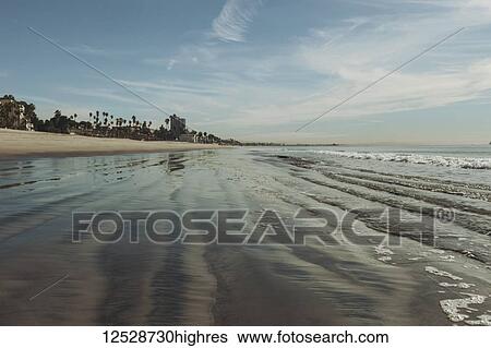 Surf washing over the rippled sand along a beach; Long Beach, California, United States of America View Large Photo Image Stock Photograph - Surf washing over the rippled sand along a beach; Long Beach, California, United States of America. Fotosearch